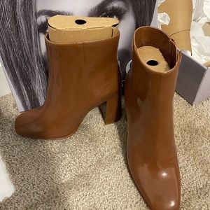 JLo brown boots. Never been worn, still in the box